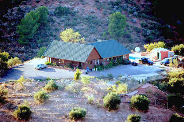 La Rosuela is a spacious South African wooden lodge of 250m2built on land of 36,000m2 bordering the , Spain