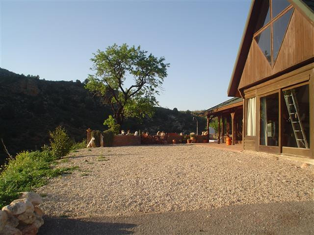 La Rosuela is a spacious South African wooden lodge of 250m2built on land of 36,000m2 bordering the Sierra de las Nieves natural park and the river...