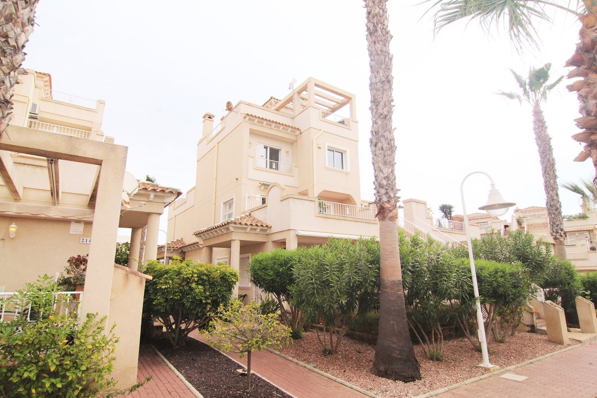 On offer is a top floor duplex in the popular Miraflores IV urbanisation in Playa Flamenca Orihuela , Spain