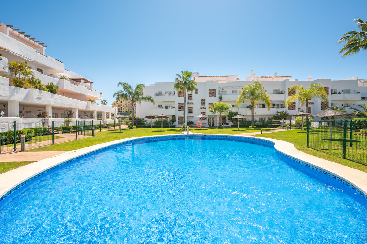 Ground floor apartment for sale in a gated private urbanization with garden area and swimming pools., Spain