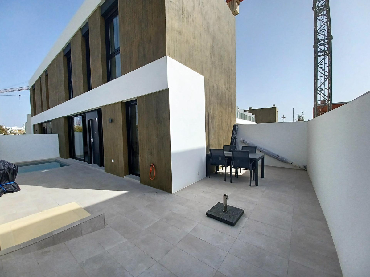 Superb, brand new, Semi-detached, three-bedroom, two-bathroom villa with its own private pool in Pil, Spain