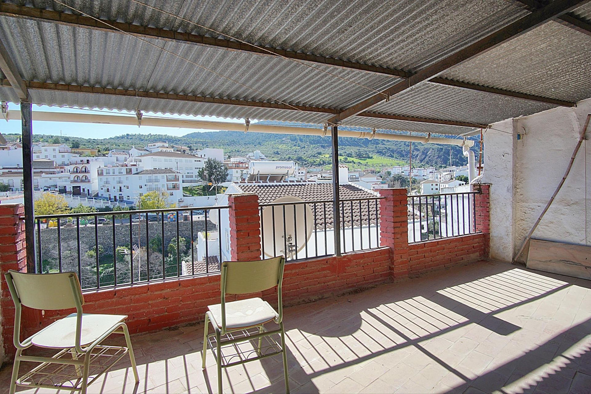 Situated on a quiet residential street in the heart of Tolox is this 1960s built townhouse requiring, Spain