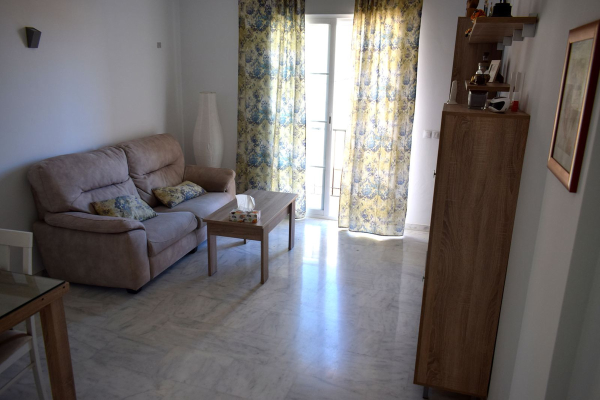 This modern apartment is located in the village of Periana and is within walking distance to all amenities.