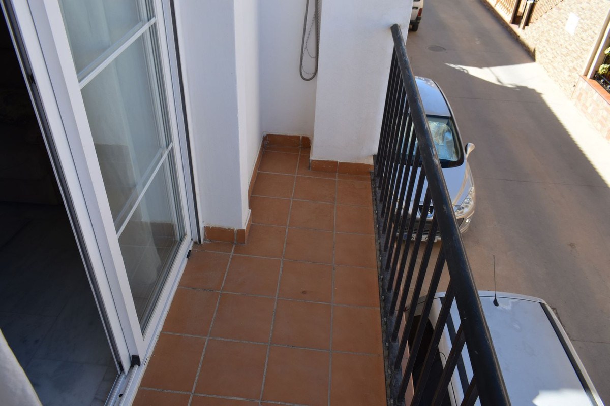 This modern apartment is located in the village of Periana and is within walking distance to all amenities.