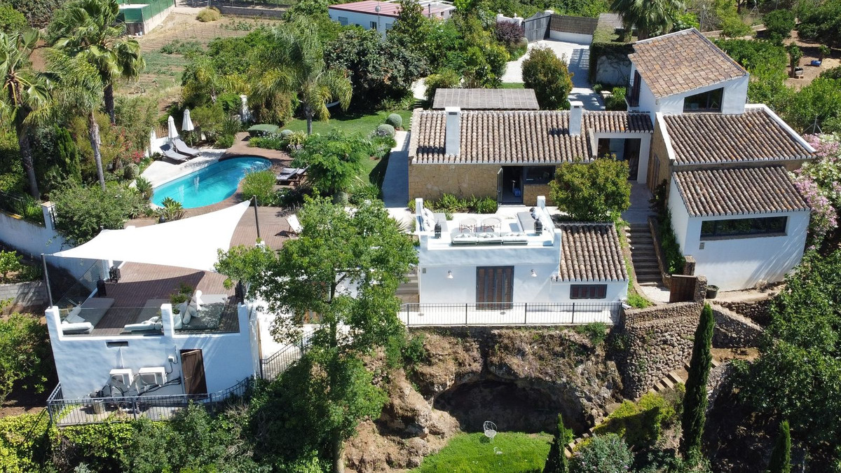 Located in a beautiful and tranquil area on the outskirts of Alhaurin el Grande, this truly unique p, Spain