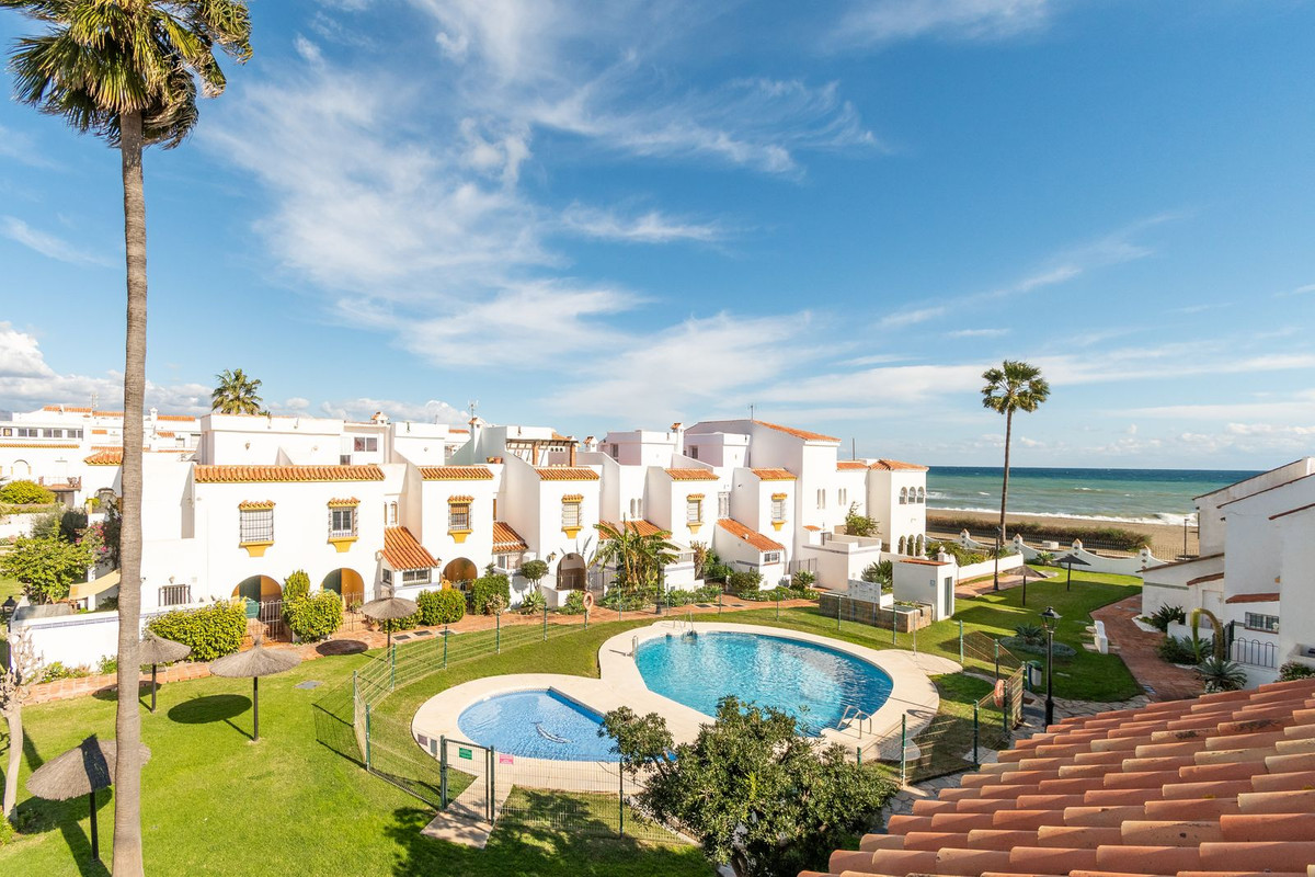 Fabulous beach side corner townhouse located in the desirable Casares Playa community, situated just, Spain
