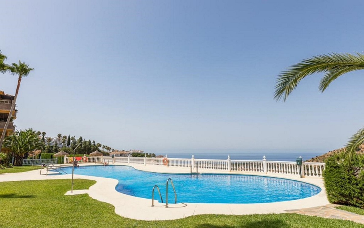 A large two bedroom corner apartment in Calahonda for sale with panoramic sea views stretching all t, Spain