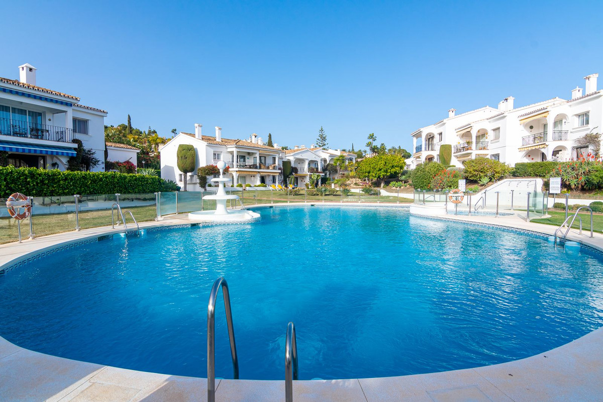 Sunny south facing one level ground floor garden apartment situated within the prestigious community, Spain
