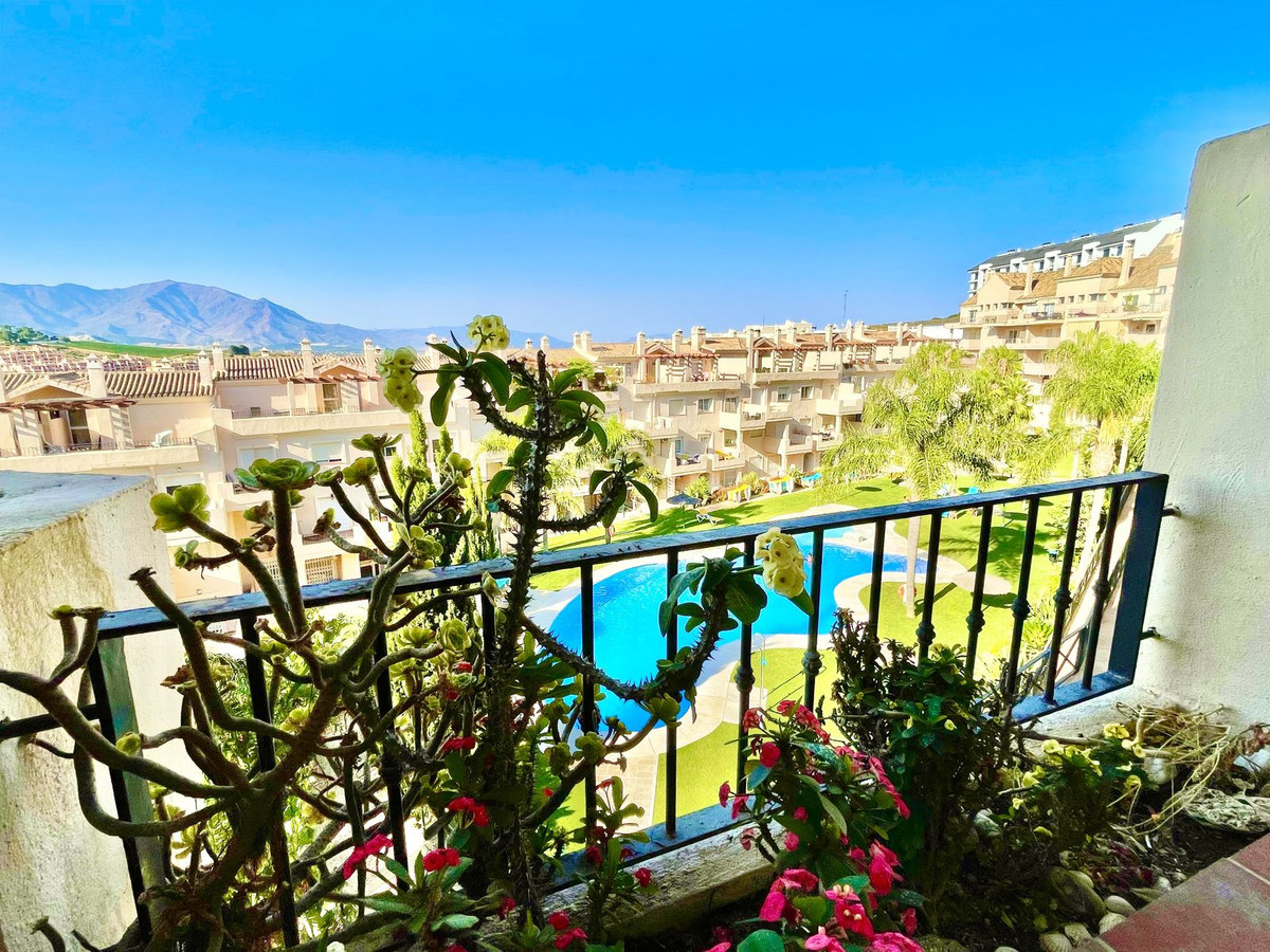 Bright well maintained two bedrooms apartment (sold furnished) with beautiful open views to the mountains, the pool and communal garden.