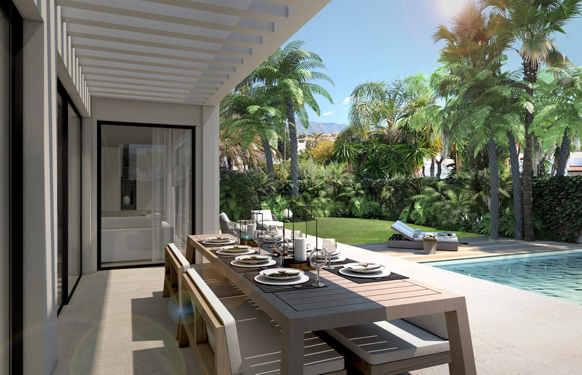 There is a large, open plan living area which includes a high end, modern island kitchen.  There are, Spain