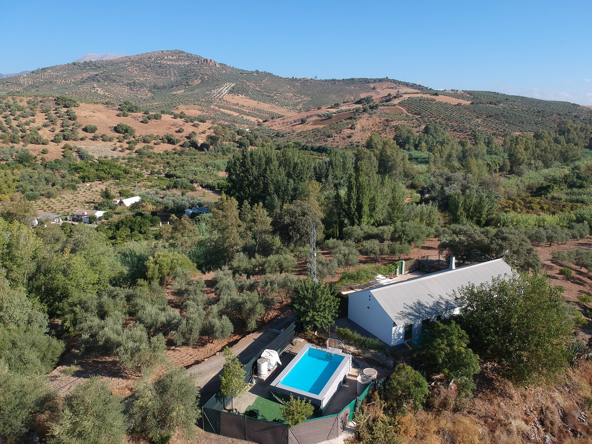 A traditional rustic country house, once used as a local school, with large olive plot close to the , Spain