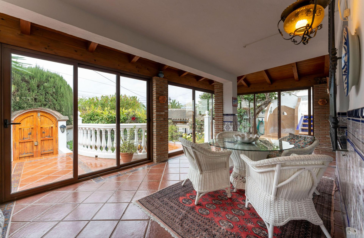 Charming Andalusian style detached villa with a lovely enclosed ‘L&apos; shaped terrace with large French patio doors, situated on a small and quaint