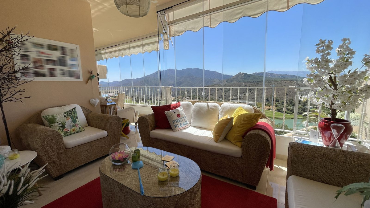 This well-appointed, front-line golf apartment has a fabulous, glazed terrace with the most spectacu, Spain
