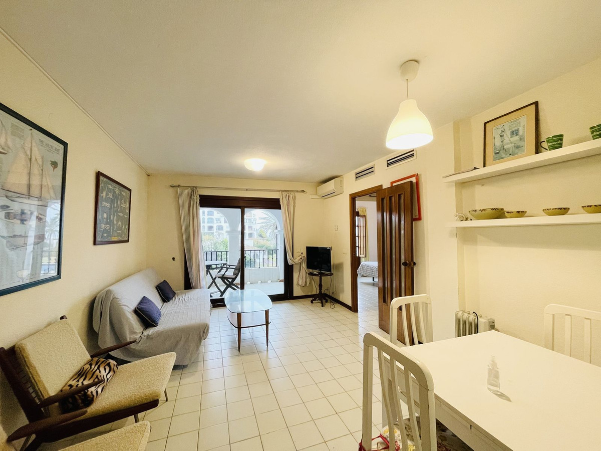 In the heart of Marina la Duquesa, this spacious second floor apartment with a lift lays in a secure and well maintained block of apartments just f...