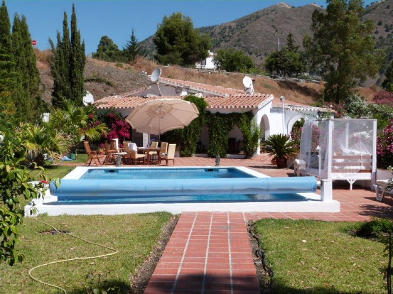This outstanding property comprises 2 separate houses, each with its own gated driveway, on a large , Spain
