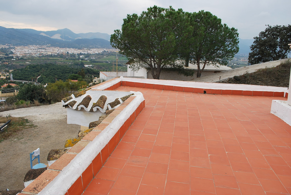 2 houses on a huge plot of 5000m2 on a top of a mountain with stunning views at Alhaurin de la torre at one side of the mountain and Malaga and the...